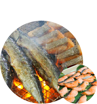 Fish is grilled over charcoal